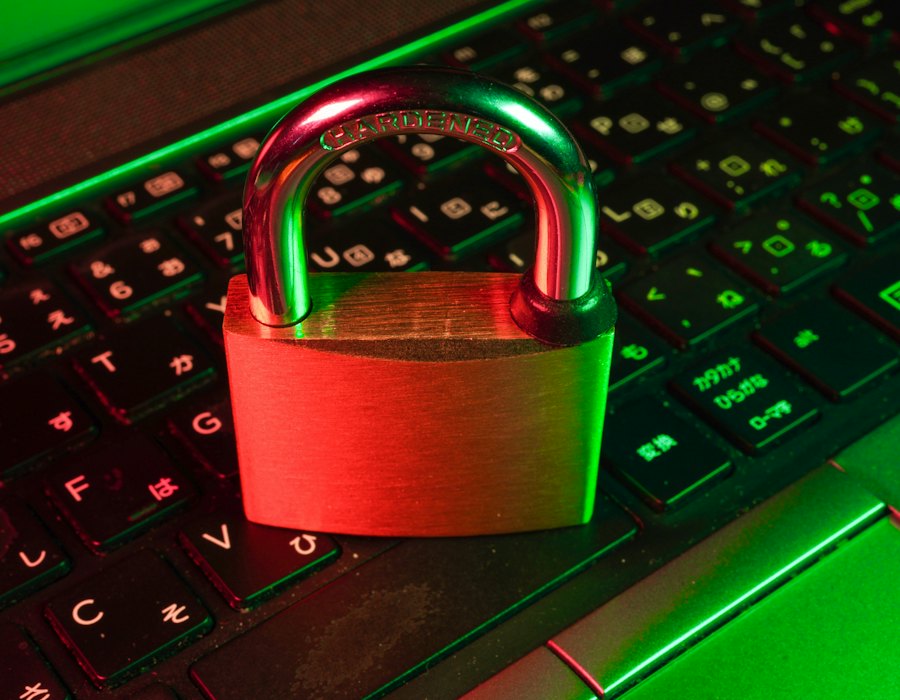 A padlock resting on a laptop keyboard